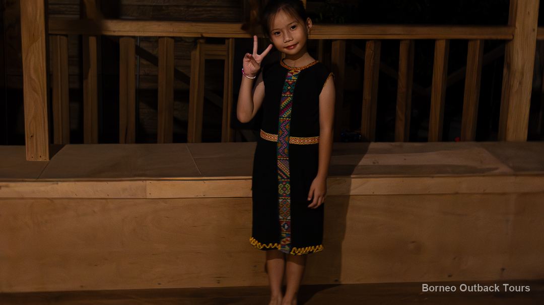 Young Murut girl in traditional beaded dress at a cultural night in Sapulot, Sabah