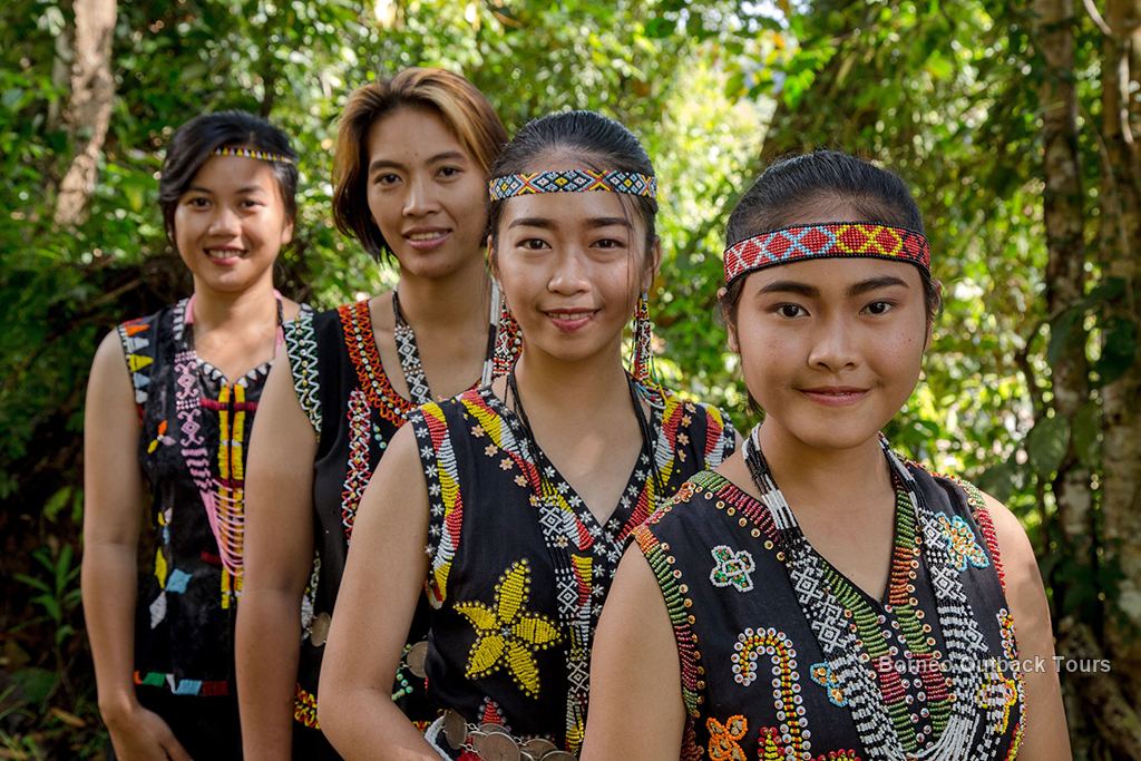 Murut men in traditional warrior dress in Sabah, Borneo, descendants of Borneo's last headhunters