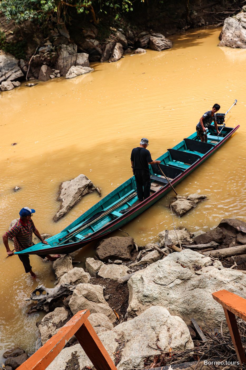 A traditional wooden longboat on a jungle river in Sapulot, the interior of Sabah, Borneo